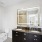 Bathroom with lit mirror and double sink
